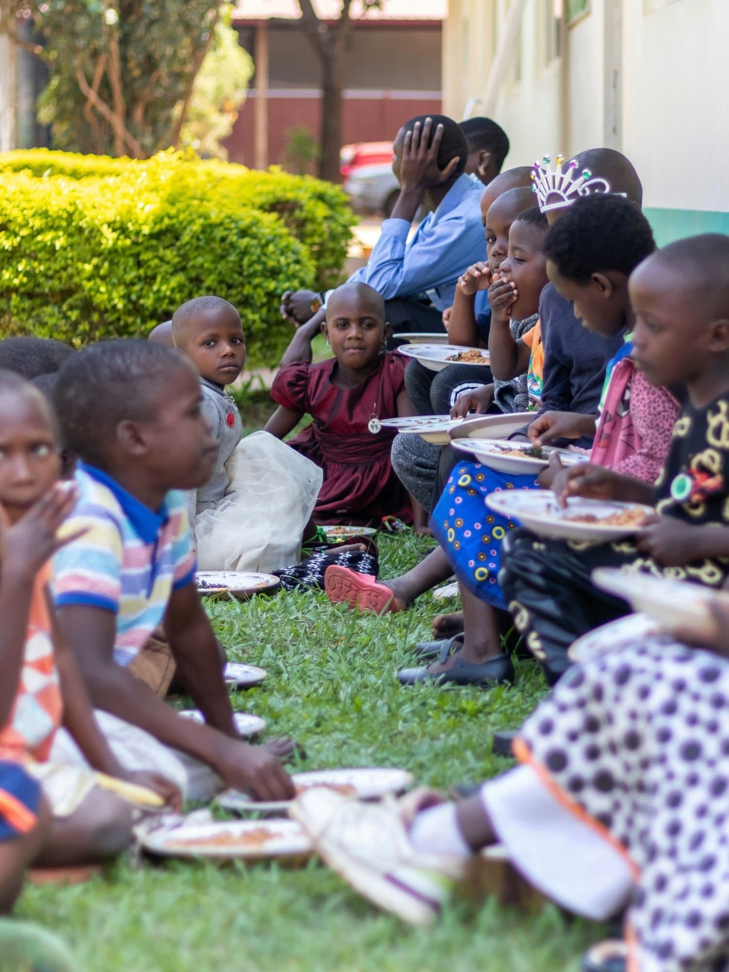Children sharing a meal together in a community setting